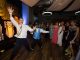 Two boys dancing in front of a crowd.