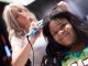 A girl getting her hair curled.