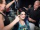 A girl getting her hair done for prom.