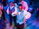 A young man dances at prom.