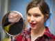 Girl looking in mirror at make-up