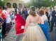 Prom couple walking the red carpet into the event