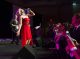 Woman singing on stage