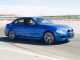 Blue BMW racing on the track at the BMW Performance Driving School