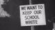 signage of a "we want to keep our schools white"