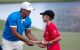 Brooks Koepka with St. Jude patient Reid
