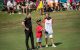 Honorary pin flag caddie St. Jude patient Quincy, center, with golfer Matt Wallace, left, and his caddie on the 18th green at the FedEx St. Jude Invitational on Sunday, July 28, 2019.