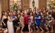 Sheila Moore, MD, (center, in red) on her 80th birthday