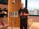 Candid photo of patient Fletcher next to an IV pole at St. Jude