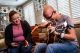 St. Jude patient Zabdi playing the guitar with his mom