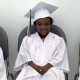 St. Jude patient keeton in his cap and gown during graduation