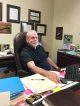 Mike Johnson at desk