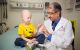 Amar Gajjar, MD, with patient Damien