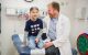 Giles Robinson, MD, with patient Totti