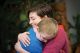 Ann Hathaway hugging young male patient