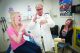 Pediatric melanoma survivor and aspiring sign language interpreter Summer Bate teaches sign language to her oncologist, Alberto Pappo, MD, during a recent checkup.