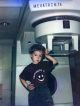 A 3-year-old Sean Kenney stands beside a Mevatron 74.