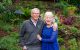 David and Mary Phillips pose in a garden.