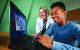 Heather Conklin, PhD, works with Caleb Mack,.