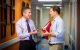 Jeffrey Rubnitz, MD, PhD, and Thomas Alexander, MD talk in the hallway.