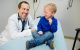 Patient Graham Robertson laughs with Dave Cervi, DO, PhD.