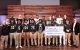 football team presents a check to St. Jude