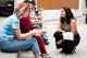 woman talking to group of students