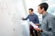 two men at whiteboard