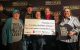 KYGO presents a check to St. Jude as part of the St. Jude Radiothon.