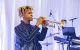 A musician plays trumpet onstage at St. Jude Celebrity Chef and Wine Dinner. 