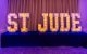 A St. Jude sign is illuminated with lights. 