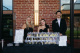 Jonathan and Natalie Stewart stand behind a podium at the St. Jude Celebrity Chef and Wine Dinner. 