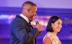 Jonathan and Natalie Stewart smile onstage at St. Jude Celebrity Chef and Wine Dinner. 