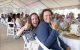 Attendees smile and make thumps-up gestures at the Colorado Unites for St. Jude Gala. 