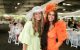 St. Jude Day at the Derby attendees smile in colorful hats and dresses. 