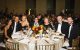 Evening of Hope attendees gather around a dining table at Fairmount Century Plaza in Los Angeles, California. 