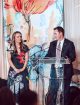 A man stands at a podium at the 2024 St. Jude Evening of Hope Oklahoma City, while a woman listens.