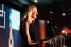 Three presenters smile and applaud onstage at St. Jude Evening with the Stars charity gala. 