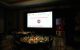 The St. Jude Hope in the Harbor dining room, with a large screen displaying event sponsors. 
