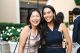 Two St. Jude Invest in Hope attendees smile in cocktail dresses. 