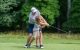 A golfer and a child practice their swing at the St. Jude New Jersey Golf Classic and Dinner Party. 