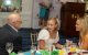 St. Jude patient Bridget and her mother at a dining table during the New Jersey Golf Classic and Dinner Party. 