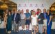 New Jersey Golf Classic and Dinner Party attendees pose with St. Jude patient Bridget. 