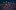 Colorful dots on a dark background. 
