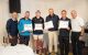 St. Jude Peninsula Golf Tournament attendees hold patient-art inspired awards. 