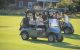 Golfers ride in carts at the St. Jude Peninsula Golf Tournament. 