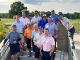 A group of golfers pose for a photo at the St. Jude Open. 
