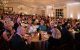 Taste of Oxford attendees sit at round tables and applaud at the 2024 event in Oxford, Mississippi. 