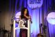 A speaker addresses the crowd from a podium at Wall Street Taste of New York. 