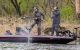Two participants catch a fish at the Dick Hiley St. Jude Bass Classic Tournament. 